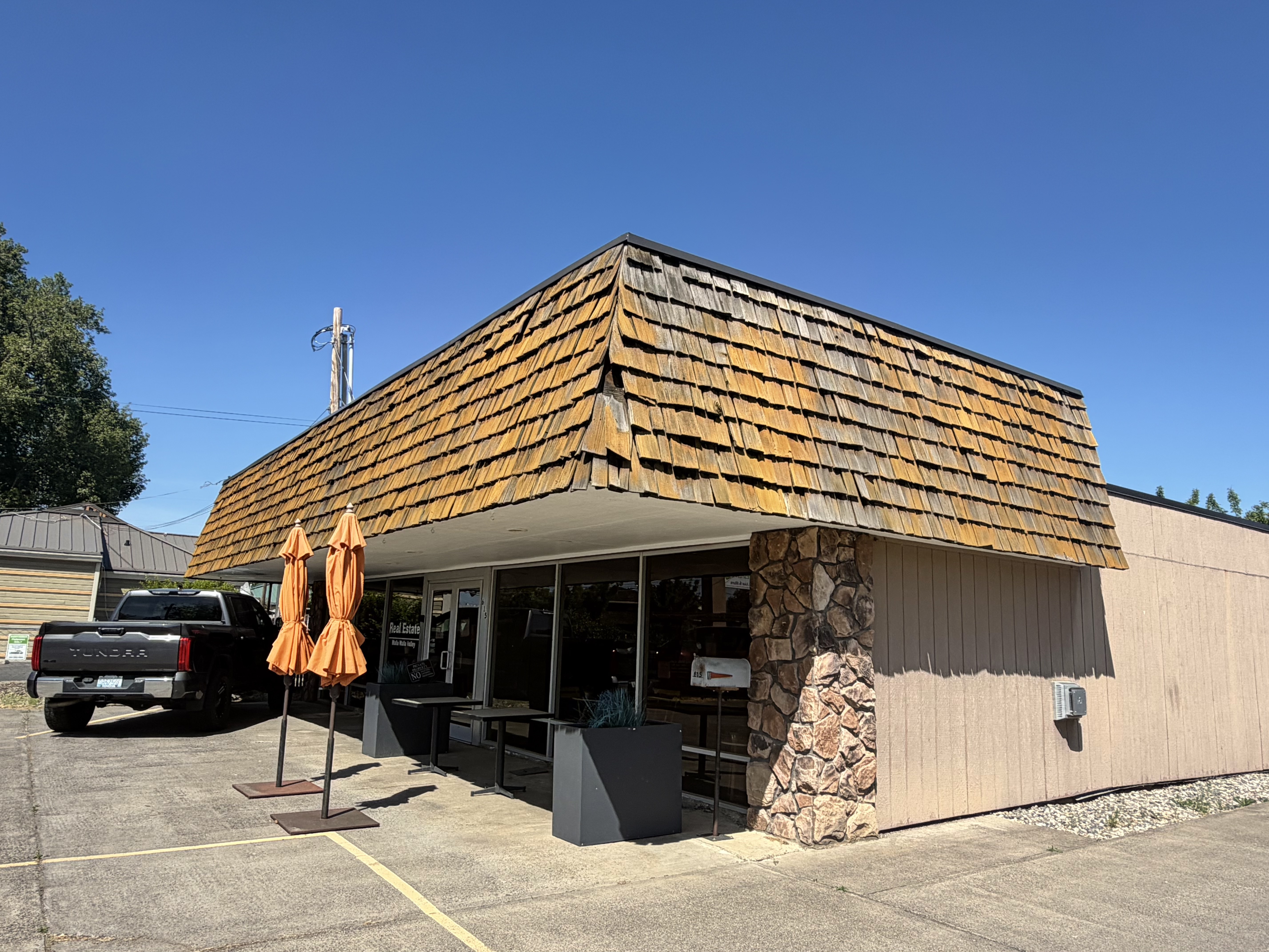 Existing cedar shake roof on the commercial office prior to replacement